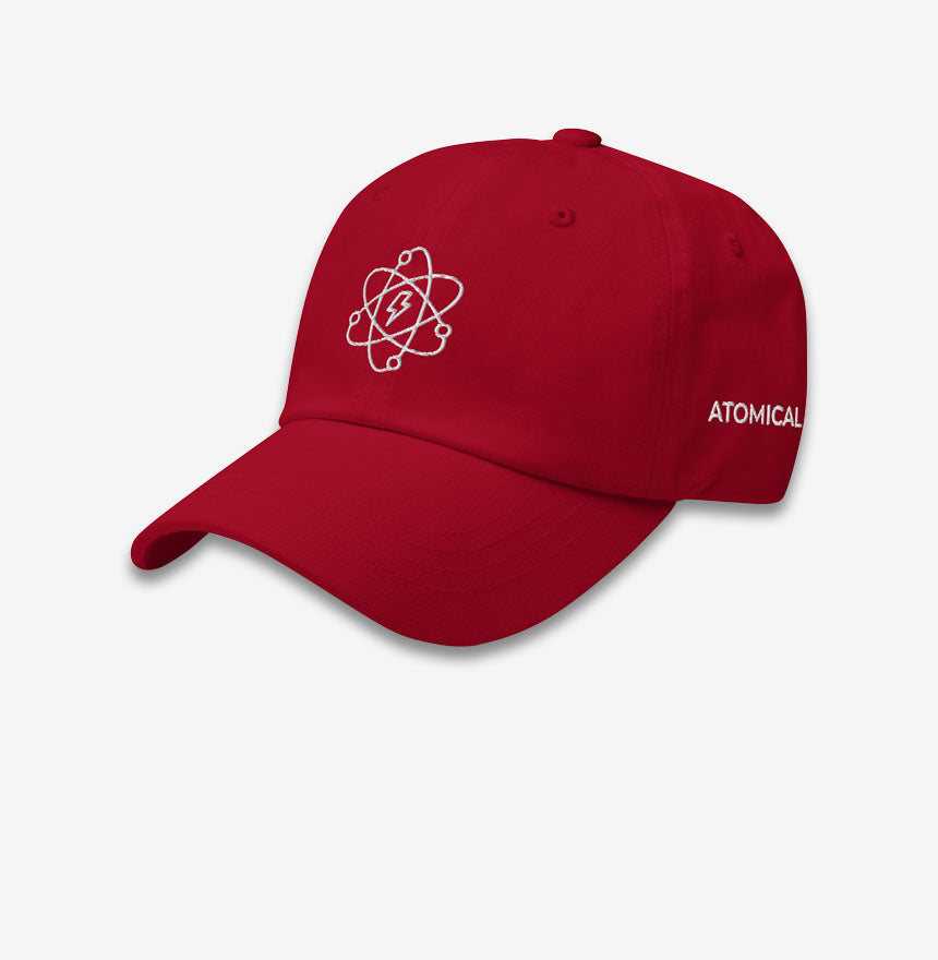 A red Atomical baseball cap, or a dad hat